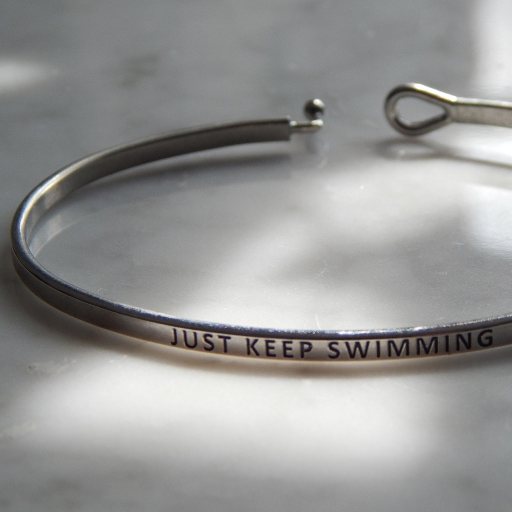 “Just Keep Swimming” silver-tone bracelet